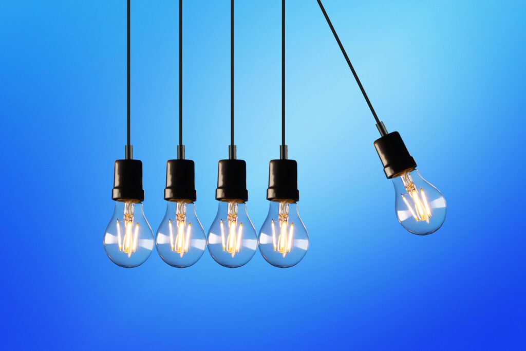 five lightbulbs in a Newton's cradle-style lineup