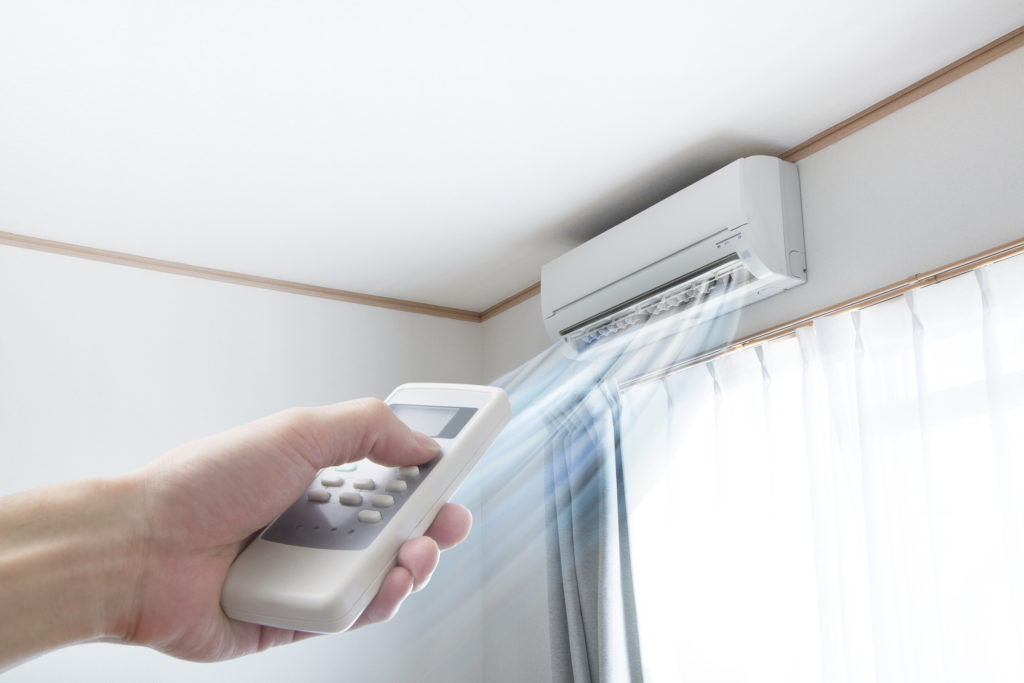 a ductless system installed in the corner of a room 