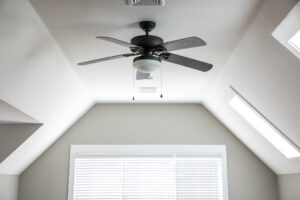 ceiling fan in middle of bedroom