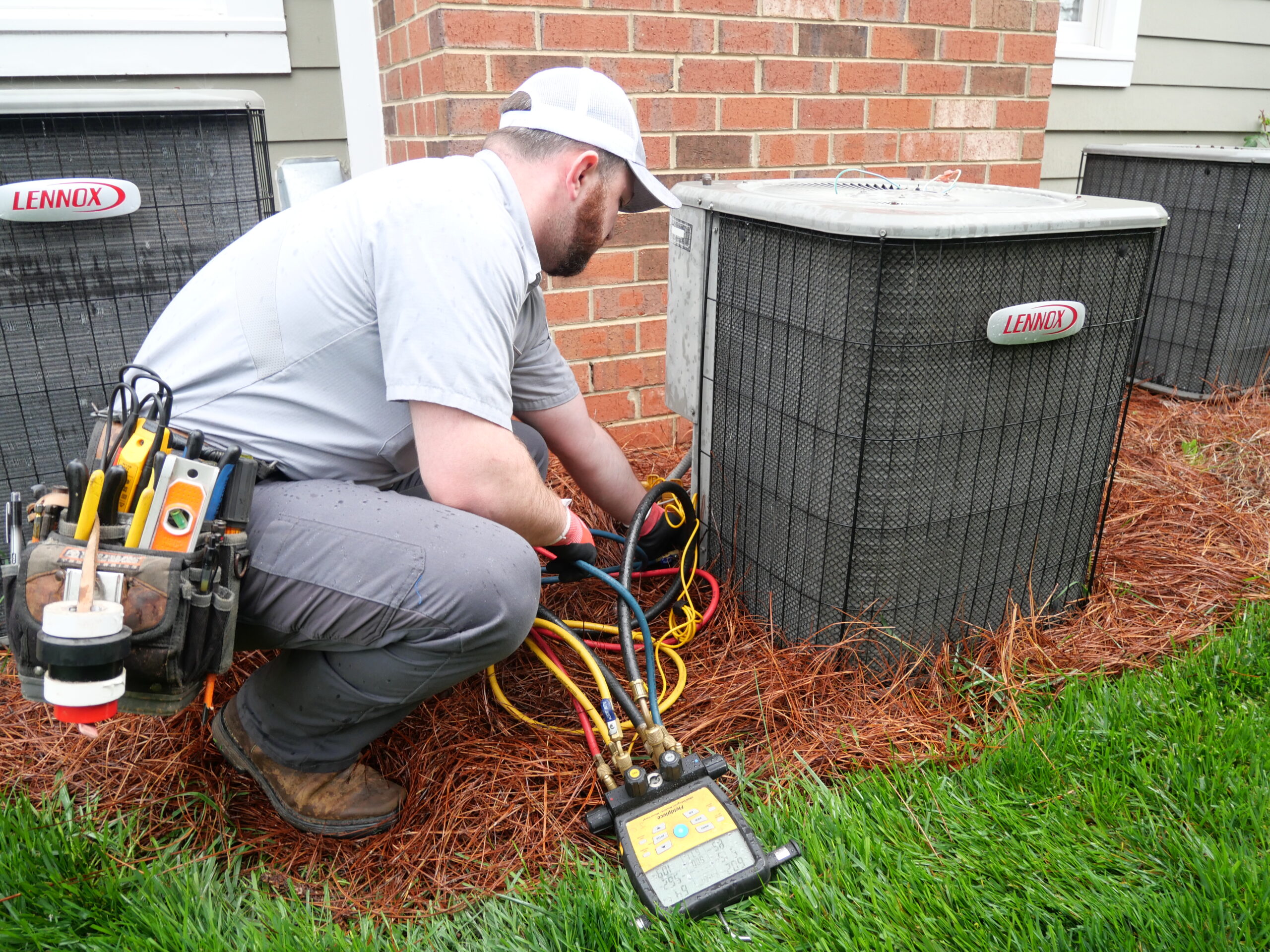 Roby technicians working on AC unit